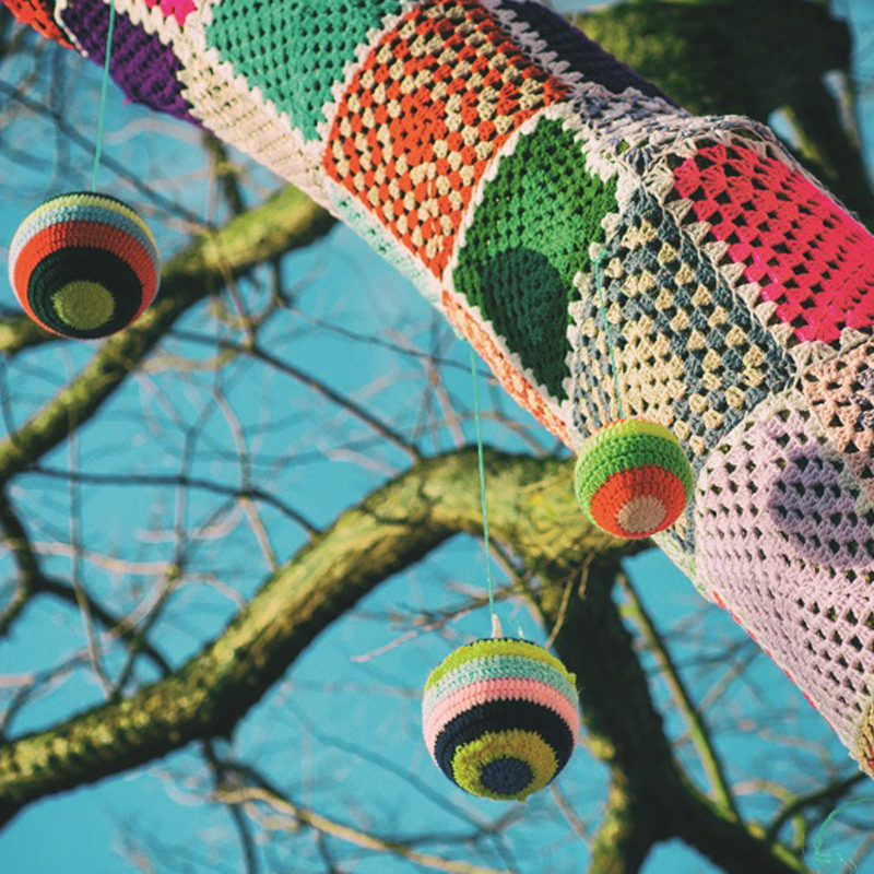 Yarn,Bomb,Tree,With,Baubles,In,The,Winter,With,Blue